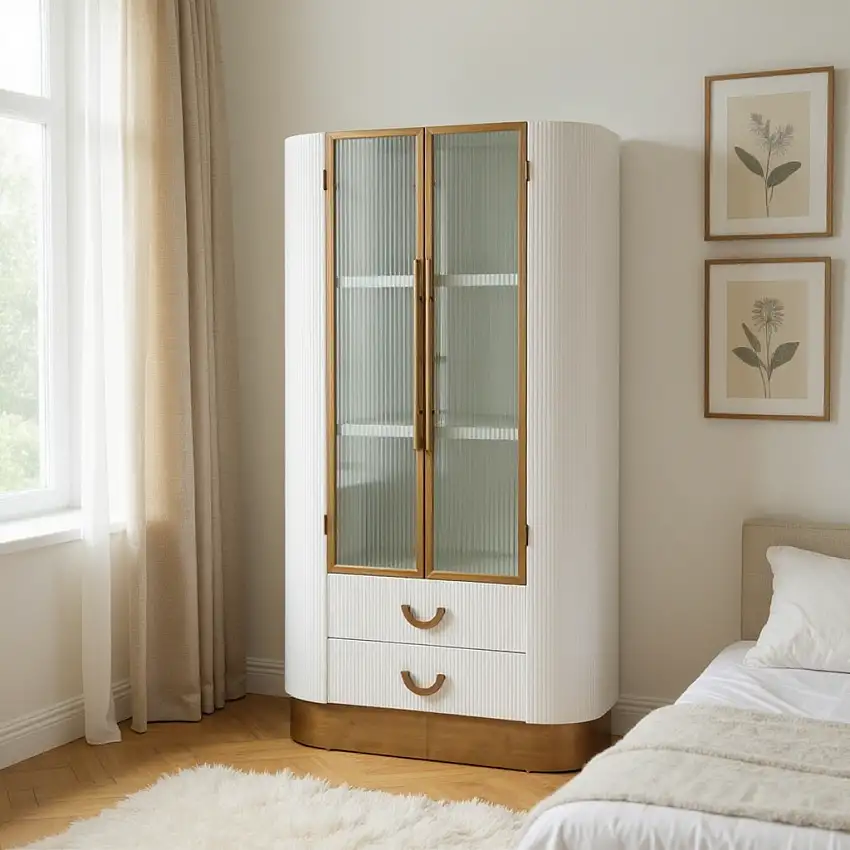 Sunlight_filtering_through_sheer_linen_curtains_in_a_bright_minimalist_bedroom_casting_a_soft_glow_on_a_white_and_bronze_Art_Deco-inspired_cabinet_inside_neatly_arranged_vintage_glass-1